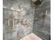 Elegant shower with marble-style tile and gold fixtures at 6462 Wild Oak Bay Blvd # 247, Bradenton, FL 34210