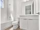 Bright bathroom featuring a tub, white cabinets, a toilet and a contemporary vanity at 8007 Nevis Run, Bradenton, FL 34202