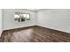 Empty bedroom with wood floors and a window at 8007 Nevis Run, Bradenton, FL 34202