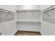 Empty walk-in closet with wood floors and shelving at 8007 Nevis Run, Bradenton, FL 34202