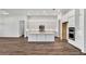 Bright kitchen with white cabinetry, stainless steel appliances, and a large island at 8007 Nevis Run, Bradenton, FL 34202