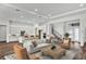 Open concept living room with a modern kitchen and staircase to the upper floor at 8007 Nevis Run, Bradenton, FL 34202