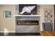 Modern linear fireplace with marble surround at 10204 46Th W Ave, Bradenton, FL 34210