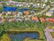 An aerial view showcasing the home's location in a community with ponds at 114 Fieldstone Dr, Venice, FL 34292