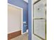 Handicap accessible bathroom with blue walls and grab bars at 114 Fieldstone Dr, Venice, FL 34292