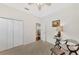 Cozy bedroom with closet, sitting area, and view to another room at 114 Fieldstone Dr, Venice, FL 34292