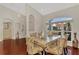 Charming dining area with natural light, wood floors, and decorative accents at 114 Fieldstone Dr, Venice, FL 34292