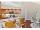 Spacious kitchen with wood cabinetry, stainless steel appliances, and breakfast bar at 114 Fieldstone Dr, Venice, FL 34292