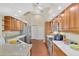 Well-appointed kitchen with wood cabinetry, stainless steel appliances, and ample counter space at 114 Fieldstone Dr, Venice, FL 34292
