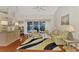 Bright and airy living room with plush seating, stylish decor, and wood floors at 114 Fieldstone Dr, Venice, FL 34292