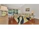 Comfortable living area with view of the pool through sliding glass doors at 114 Fieldstone Dr, Venice, FL 34292
