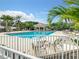 Large community pool with plenty of lounge chairs at 114 Fieldstone Dr, Venice, FL 34292