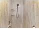 Walk-in shower with modern fixtures and built-in shelving at 114 Fieldstone Dr, Venice, FL 34292