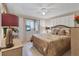 Bedroom with ceiling fan, patterned comforter, and white dresser at 1206 45Th Avenue E Dr, Ellenton, FL 34222