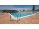 Community pool with ample lounge chairs at 1206 45Th Avenue E Dr, Ellenton, FL 34222