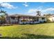 House exterior view with large backyard at 1224 Pinebrook Way, Venice, FL 34285