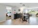 Small dining area with a square table and four chairs at 1224 Pinebrook Way, Venice, FL 34285