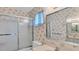 Bathroom with floral wallpaper and a bathtub at 1305 Glen Oaks E Dr # 130, Sarasota, FL 34232