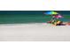 Couple relaxing on a pristine beach at 1305 Glen Oaks E Dr # 130, Sarasota, FL 34232