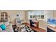 Relaxing den with window seat, comfortable seating and large TV at 1305 Glen Oaks E Dr # 130, Sarasota, FL 34232