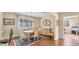 Charming dining area with wood floors and period furnishings at 1305 Glen Oaks E Dr # 130, Sarasota, FL 34232