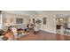 Bright living room with hardwood floors and comfy seating at 1305 Glen Oaks E Dr # 130, Sarasota, FL 34232