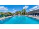 Community pool with lounge chairs at 1305 Glen Oaks E Dr # 130, Sarasota, FL 34232