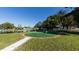 Community putting green by the pond at 1305 Glen Oaks E Dr # 130, Sarasota, FL 34232