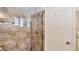 Bathroom with a tiled shower and glass enclosure at 1305 Glen Oaks E Dr # 130, Sarasota, FL 34232