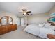 Bright bedroom with mirrored dresser and ensuite bathroom access at 13325 Sunset Shore Cir, Riverview, FL 33579