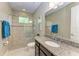 Clean bathroom with a walk-in shower and granite countertop at 13534 5Th Ne Ave, Bradenton, FL 34212