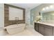 Bathroom with freestanding tub and double vanity at 13534 5Th Ne Ave, Bradenton, FL 34212