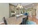 Bright dining room features a rustic wood table and modern light fixture at 13534 5Th Ne Ave, Bradenton, FL 34212