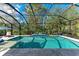 Inviting screened pool with spacious patio and lush landscaping at 13534 5Th Ne Ave, Bradenton, FL 34212