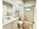 Bright bathroom featuring a shower-tub combo, large mirror, and a white vanity offering ample storage space at 1416 Glenmere Dr, Brandon, FL 33511