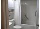 Clean bathroom featuring a tub/shower combo, toilet, vanity, and built-in shelving at 1416 Glenmere Dr, Brandon, FL 33511