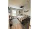 Cozy bedroom with a ceiling fan, decorated with mermaid wall art and a large window at 1416 Glenmere Dr, Brandon, FL 33511