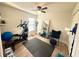 Bedroom with wood floors, ceiling fan, and fitness equipment, suited for a workout space at 1416 Glenmere Dr, Brandon, FL 33511