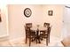 Cozy dining area featuring seating for four, neutral wall paint and tile flooring at 1416 Glenmere Dr, Brandon, FL 33511