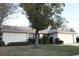 Front view of a ranch-style house with stone accents and a well-maintained lawn at 1416 Glenmere Dr, Brandon, FL 33511