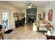 Inviting living room with a stone fireplace, ceiling fan, stylish sofa, and laminate flooring at 1416 Glenmere Dr, Brandon, FL 33511