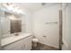 Clean bathroom with white vanity and tiled walls at 1424 Sunset Preserve Way, Port Charlotte, FL 33953