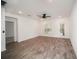 Spacious living room with wood-look tile floors and sliding glass doors at 1424 Sunset Preserve Way, Port Charlotte, FL 33953