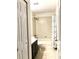 Well-lit bathroom featuring tile flooring, a shower-tub combination, and an elegant vanity at 209 Dragons Fire Pl, Valrico, FL 33594