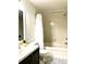 Bright bathroom with a vanity, toilet, and shower-tub combination at 209 Dragons Fire Pl, Valrico, FL 33594