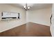 Bright dining room with wood floors and a pass-through to the kitchen at 209 Dragons Fire Pl, Valrico, FL 33594