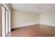 Spacious living room with hardwood floors and a large sliding glass door providing plenty of natural light at 209 Dragons Fire Pl, Valrico, FL 33594