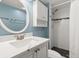 Updated bathroom with white subway tile shower and quartz countertop vanity at 2522 Clubhouse Dr # 204, Sarasota, FL 34232