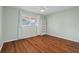 Bedroom with wood flooring, ceiling fan, and built-in shelving at 2522 Clubhouse Dr # 204, Sarasota, FL 34232