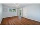 Bedroom with wood flooring, sliding door to balcony, and ceiling fan at 2522 Clubhouse Dr # 204, Sarasota, FL 34232